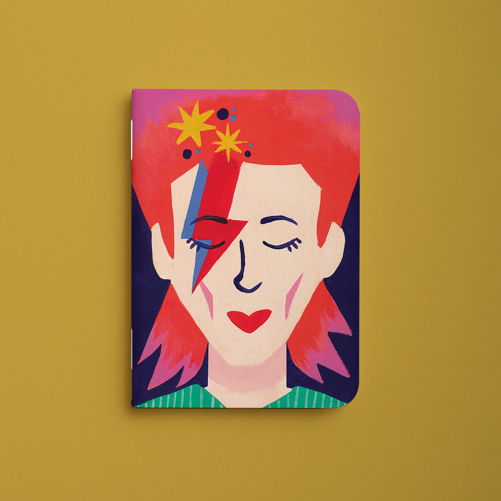 Carnet de poche Starman, couverture illustrée d'un portrait roux au visage barré d'un éclair rouge et bleu