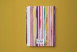 Dos du carnet rayé du trio papeterie coloré, rayures peintes et signature Hello couleur