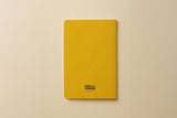 Dos du carnet du pack Signature Frida, couverture jaune moutarde unie signée Hello couleur