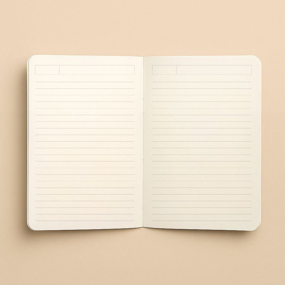 Carnet A5 Les Citrons ouvert à plat, pages intérieures lignées de couleur ivoire