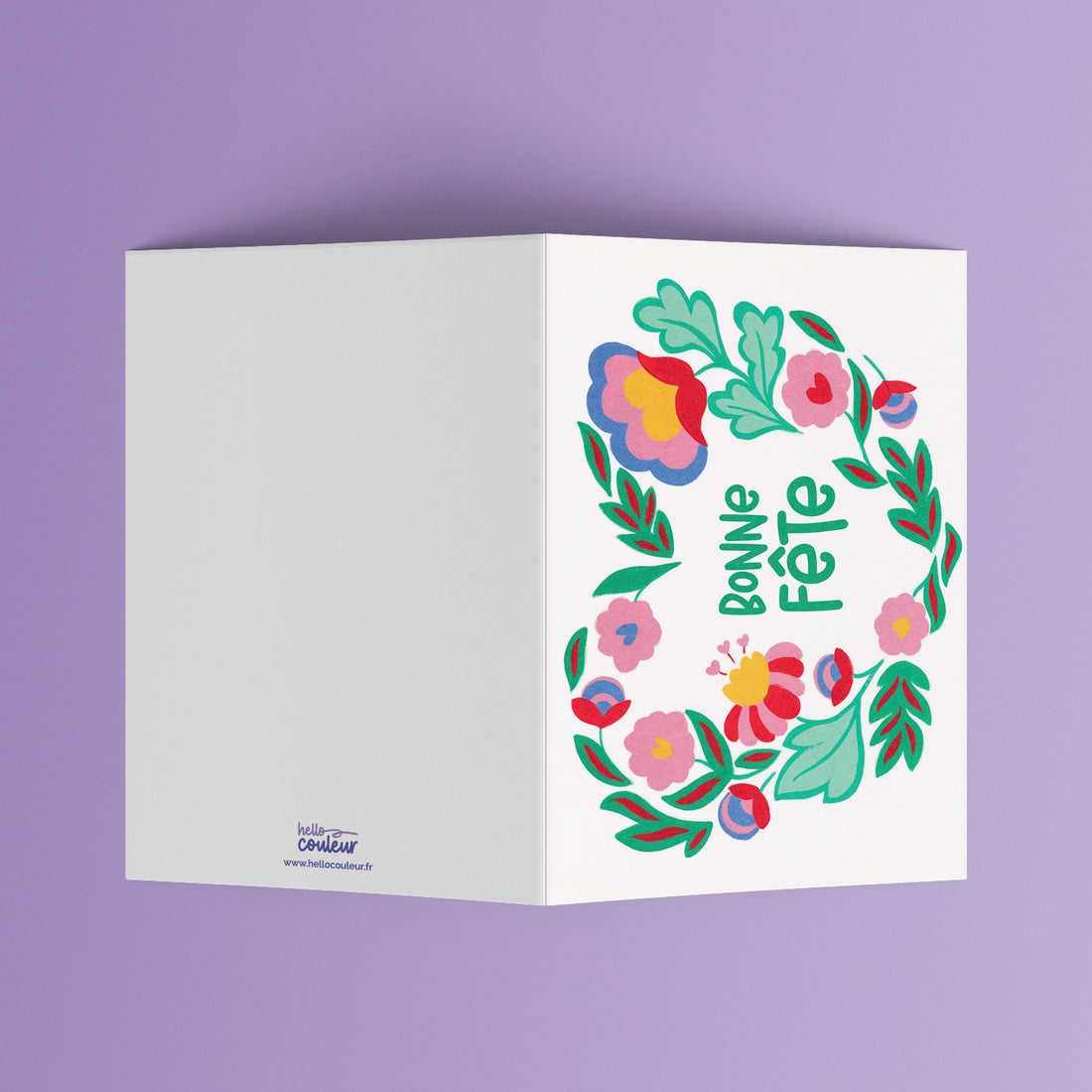 Carte pliée Bonne fête cœur ouverte, message entouré d'une couronne de fleurs peintes